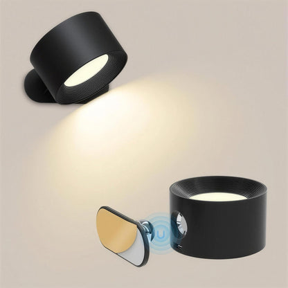 Nook cordless wall lamp in black, lifting off its magnetic mount