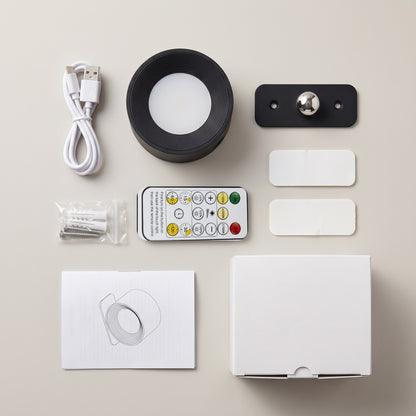 Everything in the Nook lamp box: lamp, magnetic mount, remote, USB-C cable, 2 adhesive pads, screws and wall plugs, manual