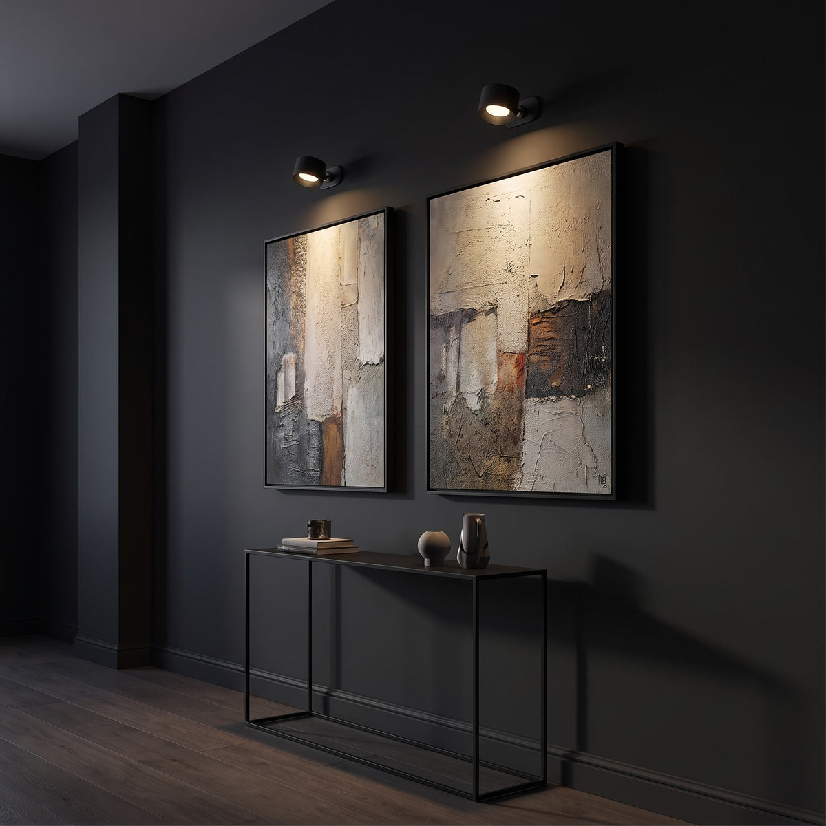 Two black Nook lamps lighting artwork in a dark corridor