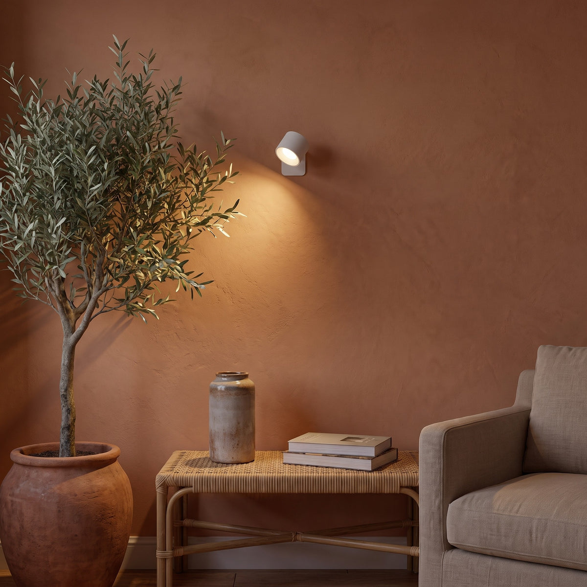 White Nook lamp as a warm accent light beside an olive tree