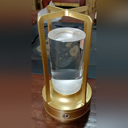 Nook Glow Lantern in gold, clear cylinder inside the frame
