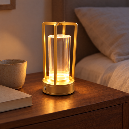 Gold Nook Glow Lantern lit on a bedside table