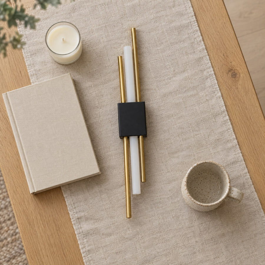 Illustration: One sconce lying on a table runner, switched off.