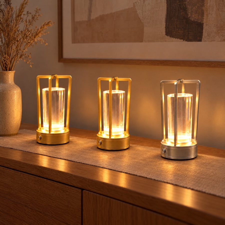 Illustration: Three in a row on a console table: two gold, one silver.